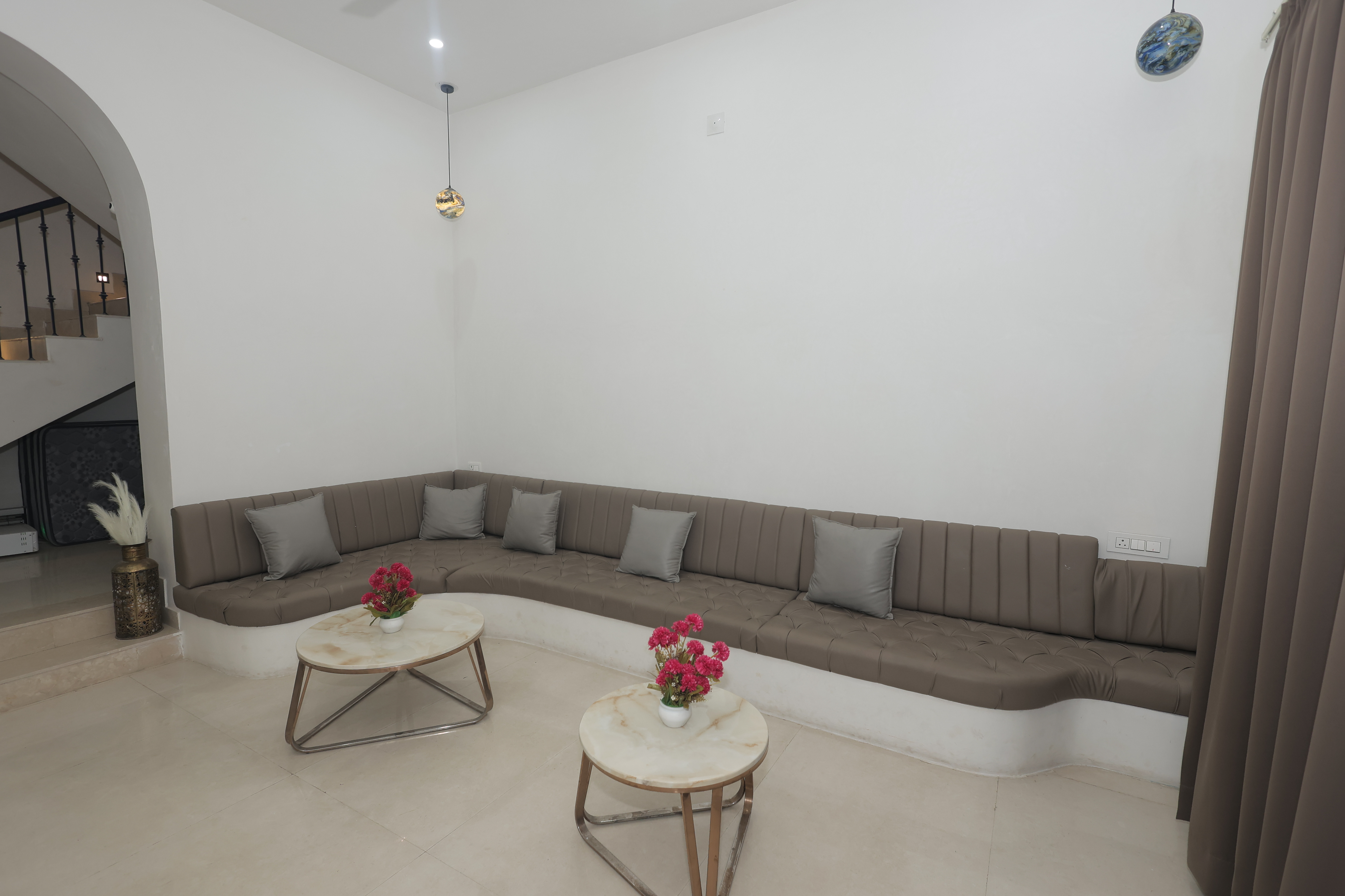 Luxury bedroom with modern amenities at Maple Roots Villa